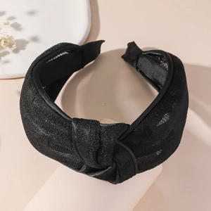 Sparkly black wide knotted headband with silver glitter fabric for an elegant look