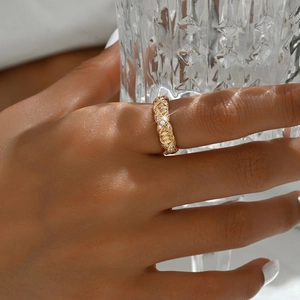 Elegant gold woven chain ring with diamonds in classic quilted pattern for women