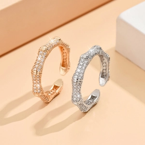 Irregular bamboo design open rings in gold and silver finish with sparkling zircon stones