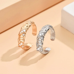 Close-up of chain-braided adjustable rings with shimmering micro-pave cubic zirconia