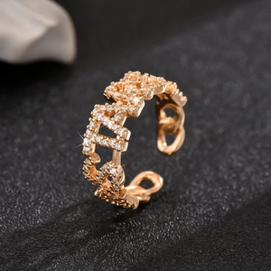 Macro shot of 18K gold plated hollow chain ring with shimmering white zircon stones