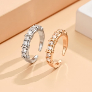 Crisscross adjustable rings with cubic zirconia in silver and rose gold finishes