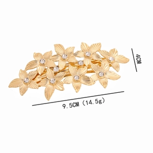 Elegant gold flower hair clip with rhinestones, vintage metal leaf spring barrette style