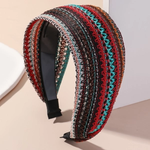 Detailed close-up of bohemian knit headband showing colorful geometric weave patterns