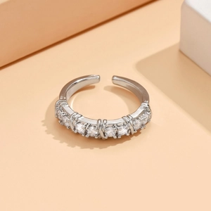 Macro detail of silver adjustable ring featuring seven sparkling round cut zircons
