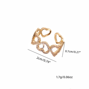 Anello regolabile in rame con cuori intrecciati e pietre di zircone in finitura oro