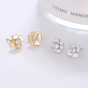 Elegant gold and silver cross stud earrings with sparkling cubic zirconia stones