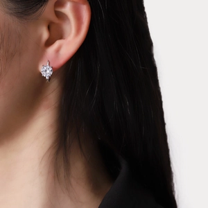 Classic silver U-shaped moissanite earrings with a sparkling four-prong round zircon setting