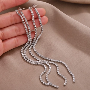 Elegant long silver tassel drop earrings with sparkling rhinestones in a layered design