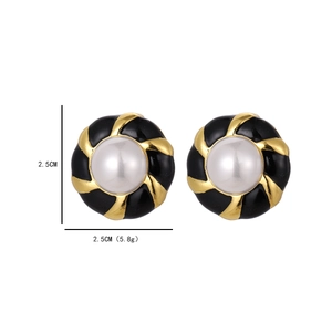 Vintage gold-plated round button earrings with white faux pearl and black enamel detail