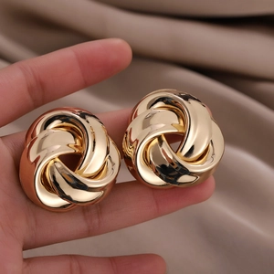 Chic twisted golden hoop earrings featuring a vintage textured knot design for women