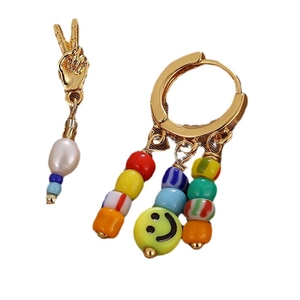 Asymmetric beaded earrings with golden hand gesture and colorful smiley face beads