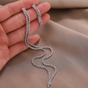 Elegant long silver tassel drop earrings with sparkling rhinestones for evening wear