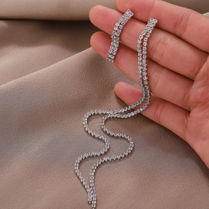 Elegant long silver tassel earrings with shimmering rhinestones for evening wear