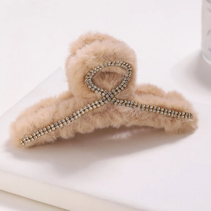Plush faux fur hair claw clip with cross rhinestone chain in warm beige for women