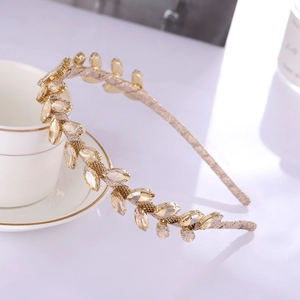Serre-tête branche d'olivier dorée avec cristaux feuilles champagne et détails chic