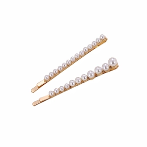 Ensemble de barrettes à cheveux dorées avec perles blanches au design minimaliste