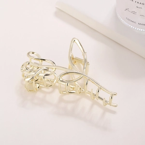 Elegante pinza de metal dorado con diseño de tulipán calado minimalista para el cabello