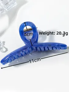 Detail view of navy blue marble hair claw clip with 11cm length and 20.3g weight