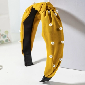 Cross knotted bright yellow fabric headband with elegant white pearls for women