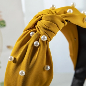 Mustard yellow wide knotted fabric headband with white faux pearls for women