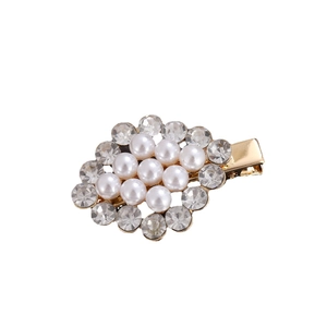 Elegant gold duckbill hair clip with white faux pearls and clear rhinestones on white background