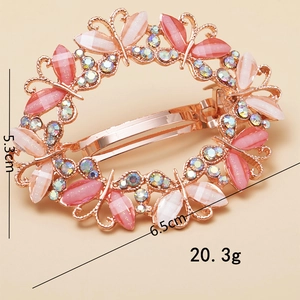 Elegant rose gold butterfly hair clip with pink stones and crystals, size 6.5x5.3cm