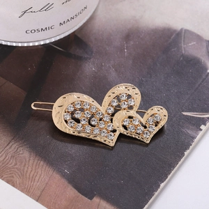 Pince à cheveux élégante en forme de cœur doré avec strass brillants pour un look luxueux