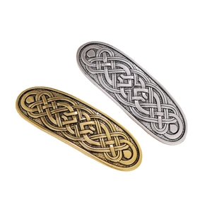 Vintage Celtic knot hair clips set in gold and silver finish with embossed metal texture
