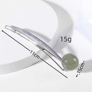 Detail view of 11cm lilac glitter hair clip with grey-green ball ornament specs