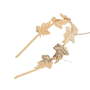 Golden baroque leaf headband with detailed maple foliage design on white background