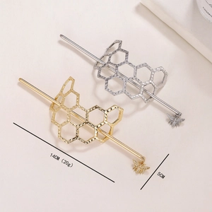 Golden and silver honeycomb hairpins with bee charms and hammered metal texture
