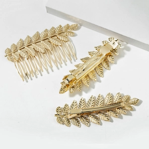 Three-piece golden metal leaf hair comb and clip set with elegant textured finish