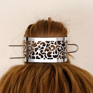 Elegant hollow metal hair stick and crown set with silver vintage pattern on dark hair
