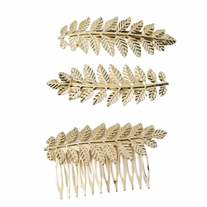 Golden metal leaf hair comb and clip set with detailed vein textures on white background