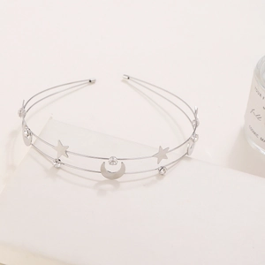 Silver double-layered metal headband featuring star and moon charms with crystals