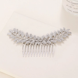 Detail view of silver leaf hair comb with 14 teeth and fine metallic vein textures