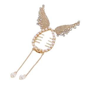 Golden angel wing hair clip with rhinestones and hanging pearl tassels on white background