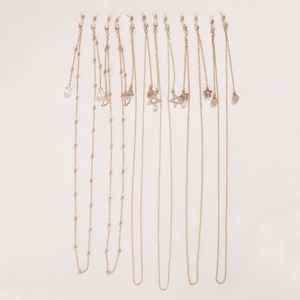 Chaînes de lunettes dorées avec pendentifs perles et étoiles et boucles en silicone