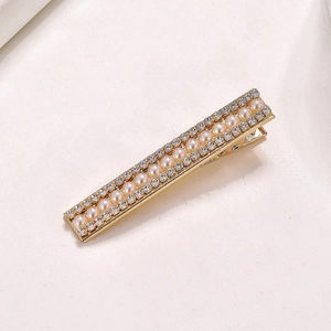 Barrette élégante en alliage doré avec perles d'imitation blanches et strass brillants