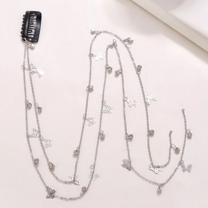 Silver multi-layer hair chain with butterfly pendants and metal clips on white background