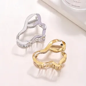 Irregular liquid metal hollow hair claw clips in silver and gold 6cm mid-size