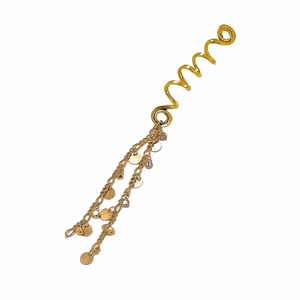 Detail view of gold spiral hair clip with rhinestone tassels and metal disk charms