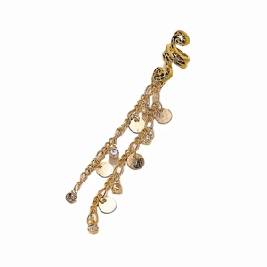 Close-up of gold hair clip with spiral patterns, delicate chains and sparkling rhinestones