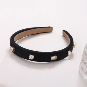 French retro black satin headband with pearls and rhinestones on geometric stand