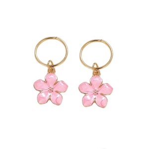 Detailed close-up of pink cherry blossom pendant earrings with gold hoop closures