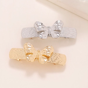 Elegant hollow butterfly hair clips in gold and silver metal with textured hammer finish