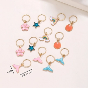 Detail of colorful enamel dreadlock charms with mermaid tail and star pendants