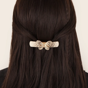 Vintage golden hollow butterfly hair clip with brushed metal texture for women