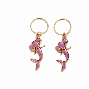 Detail of mermaid pendant earrings with golden outline and purple enamel finish